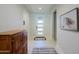 Bright foyer with wood cabinet and area rug at 3020 N 165Th Ave, Goodyear, AZ 85395