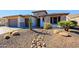 Landscaped front yard with drought-tolerant plants and gravel at 3020 N 165Th Ave, Goodyear, AZ 85395