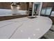 Close up of kitchen island with expansive quartz countertops at 3020 N 165Th Ave, Goodyear, AZ 85395