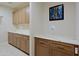 Laundry room with built in cabinets and quartz countertops at 3020 N 165Th Ave, Goodyear, AZ 85395