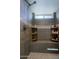 Large walk-in shower with gray tile and built-in shelving at 3020 N 165Th Ave, Goodyear, AZ 85395