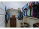 Large walk-in closet with dresser and hanging rods at 3020 N 165Th Ave, Goodyear, AZ 85395