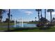 Serene water feature with fountains, palm trees, and lush landscaping at 3020 N 165Th Ave, Goodyear, AZ 85395