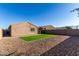 Artificial turf and gravel backyard with block wall at 30358 N Juniper Dr, Florence, AZ 85132