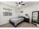 Bedroom with full bed, dresser, mirror and ceiling fan at 30358 N Juniper Dr, Florence, AZ 85132