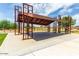 Modern covered patio area with metal frame and concrete flooring at 30358 N Juniper Dr, Florence, AZ 85132