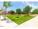 Landscaped cornhole area with artificial turf and seating at 30358 N Juniper Dr, Florence, AZ 85132