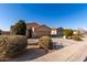 Tan house with brown garage door and landscaping at 30358 N Juniper Dr, Florence, AZ 85132