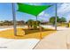 Play area with slide and shade structure, near other amenities at 30358 N Juniper Dr, Florence, AZ 85132