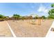 Community playground with swings and climbing structures at 30358 N Juniper Dr, Florence, AZ 85132