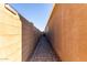 Brick pathway between block walls leading to backyard at 30358 N Juniper Dr, Florence, AZ 85132