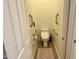 Small bathroom with an elevated toilet and grab bars at 31655 N 131St Ave, Peoria, AZ 85383