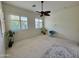 Spacious bedroom with ceiling fan and large windows at 31655 N 131St Ave, Peoria, AZ 85383