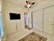 Bedroom with large closet, TV mount, and ceiling fan at 31655 N 131St Ave, Peoria, AZ 85383