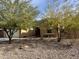 Charming house with desert landscaping, a walkway to the front door, and rock accents at 31655 N 131St Ave, Peoria, AZ 85383