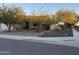 House exterior view showcasing desert landscaping and a brick wall at 31655 N 131St Ave, Peoria, AZ 85383