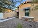 House exterior view with a walkway, desert landscaping, and solar shades at 31655 N 131St Ave, Peoria, AZ 85383