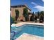 Inviting pool with spacious patio, lush landscaping, and a relaxing atmosphere at 31655 N 131St Ave, Peoria, AZ 85383