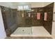 Large walk-in shower with built-in seat and grab bars at 31655 N 131St Ave, Peoria, AZ 85383