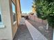 Side yard with paved walkway and landscaping at 31655 N 131St Ave, Peoria, AZ 85383