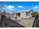 Large grassy backyard with a kidney-shaped pool and a view of the house at 3383 E Santa Fe Ln, Gilbert, AZ 85297