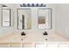 Bathroom with double sink vanity with modern fixtures and ample counter space at 3383 E Santa Fe Ln, Gilbert, AZ 85297