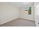 Neutral bedroom with carpet, a window providing natural light, and closet at 3383 E Santa Fe Ln, Gilbert, AZ 85297