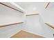 Walk-in closet with built-in shelving and carpet flooring for efficient storage and organization at 3383 E Santa Fe Ln, Gilbert, AZ 85297
