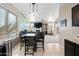 Bright dining area with a view of the living room and fireplace at 3383 E Santa Fe Ln, Gilbert, AZ 85297