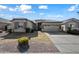 One-story house with stone accents and a two-car garage at 3383 E Santa Fe Ln, Gilbert, AZ 85297