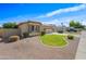 Well-kept single-story home with a grassy front yard and desert landscaping accents at 3383 E Santa Fe Ln, Gilbert, AZ 85297