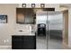 Kitchen boasts granite countertops and stainless steel refrigerator at 3383 E Santa Fe Ln, Gilbert, AZ 85297