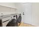 Functional laundry room with modern washer and dryer at 3383 E Santa Fe Ln, Gilbert, AZ 85297