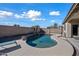 Relaxing kidney-shaped pool surrounded by a spacious patio at 3383 E Santa Fe Ln, Gilbert, AZ 85297