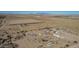 Aerial view showing a house, pool, and surrounding desert landscape at 34150 W Corleone Dr, Maricopa, AZ 85138