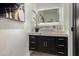 Elegant bathroom with dark vanity and marble countertop at 34150 W Corleone Dr, Maricopa, AZ 85138