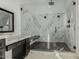 Luxury bathroom featuring a large walk-in shower with marble surround at 34150 W Corleone Dr, Maricopa, AZ 85138