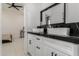 Modern bathroom with double vanity and dark countertops at 34150 W Corleone Dr, Maricopa, AZ 85138