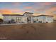 Modern single-story home with covered porch and desert landscaping at 34150 W Corleone Dr, Maricopa, AZ 85138