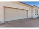 Attached garage with a large door and ample space at 34150 W Corleone Dr, Maricopa, AZ 85138