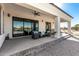 Covered patio with seating area and pool access at 34150 W Corleone Dr, Maricopa, AZ 85138