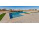 Refreshing pool with waterfall feature and ample patio space at 34150 W Corleone Dr, Maricopa, AZ 85138