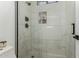 Clean shower with glass enclosure and marble tile at 34150 W Corleone Dr, Maricopa, AZ 85138