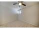 Simple bedroom with ceiling fan, tile floor, and mirrored closet at 3416 N 44Th St # 35, Phoenix, AZ 85018