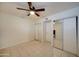 Bright bedroom with ceiling fan, tile floor, and mirrored closet doors at 3416 N 44Th St # 35, Phoenix, AZ 85018