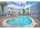 Inviting kidney-shaped pool with surrounding patio and lounge chairs at 3416 N 44Th St # 35, Phoenix, AZ 85018