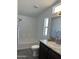 Bathroom with tub, toilet, vanity, and dark brown cabinets at 38007 W Mcdowell Rd, Tonopah, AZ 85354