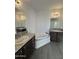 Main bathroom with corner tub and double vanity at 38007 W Mcdowell Rd, Tonopah, AZ 85354