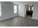 Bedroom with gray vinyl flooring and access to bathroom at 38007 W Mcdowell Rd, Tonopah, AZ 85354