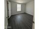 Spacious bedroom with gray flooring and large window at 38007 W Mcdowell Rd, Tonopah, AZ 85354